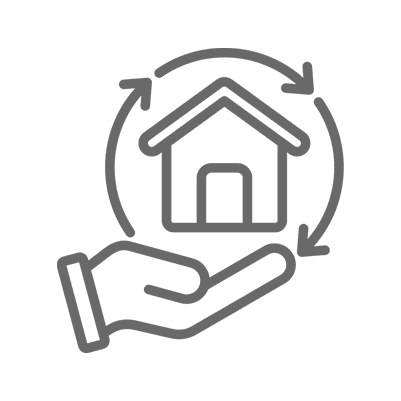 Hand holding house with recycling arrows.