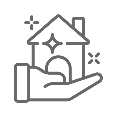 Hand holding a sparkling house icon.